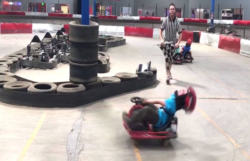 kid spinning on go kart