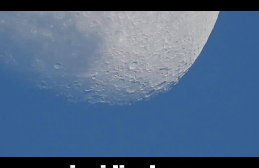 Camera Lens Zooms In Close On The Moon