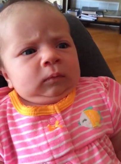 Baby isn't amused with her Dad