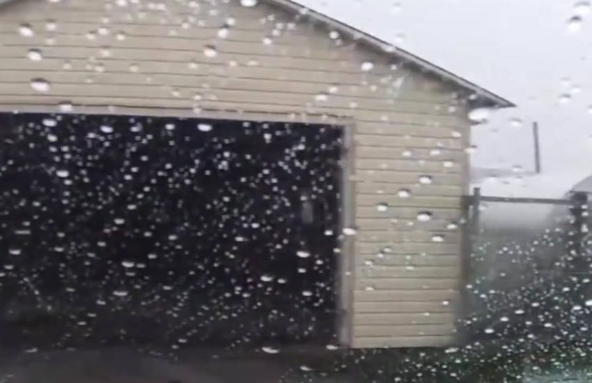 Guy pulls out of his garage and straight into a tornado