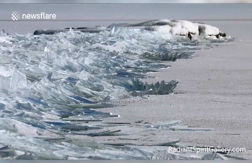 Mesmerising Ice Waves Crash On Shoreline