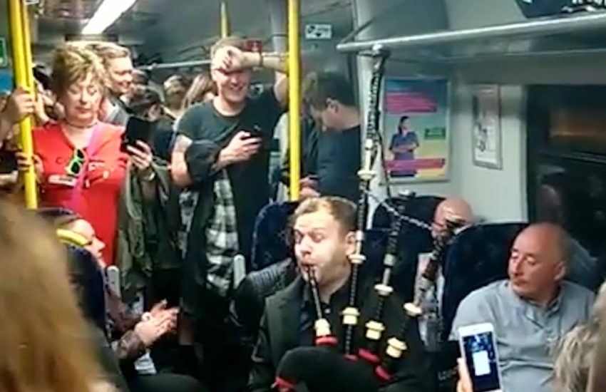 Scots Sing And Chant To Bagpipes On Train