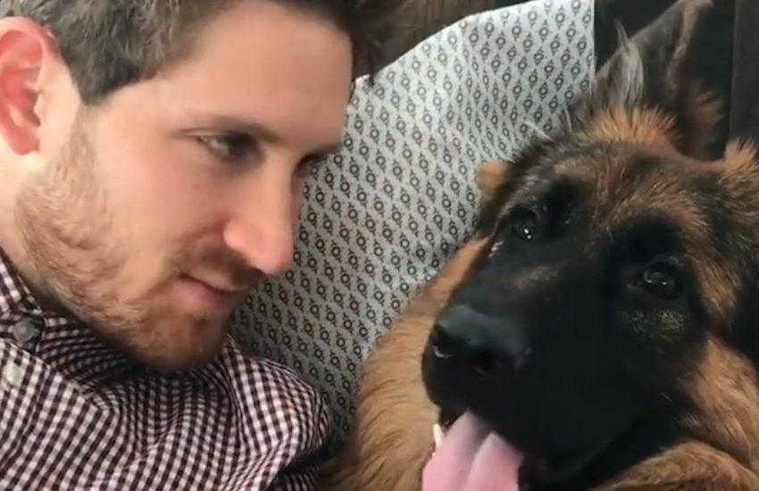 Dog and Owner Kiss Back And Forth