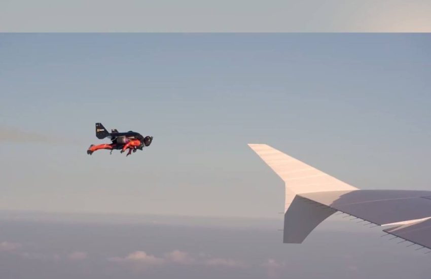 Jet-wing suits flying next to an airbus