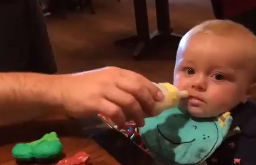 Baby takes shot of milk